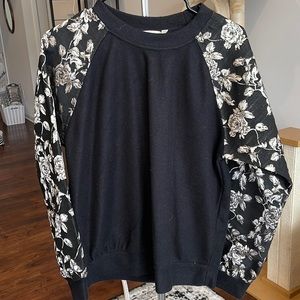 Black crew neck with rose detailed sleeves small